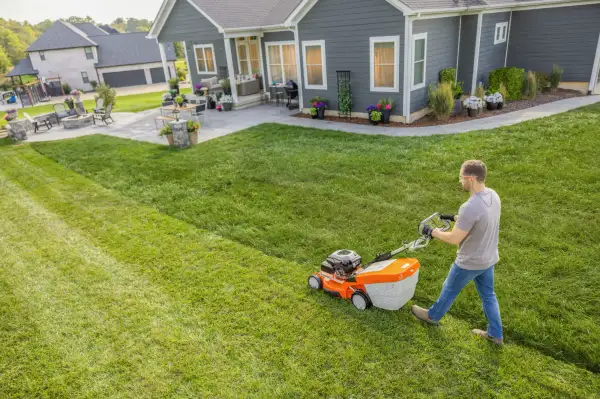 Relaxing in a tidy garden chair with a STIHL tool in the background