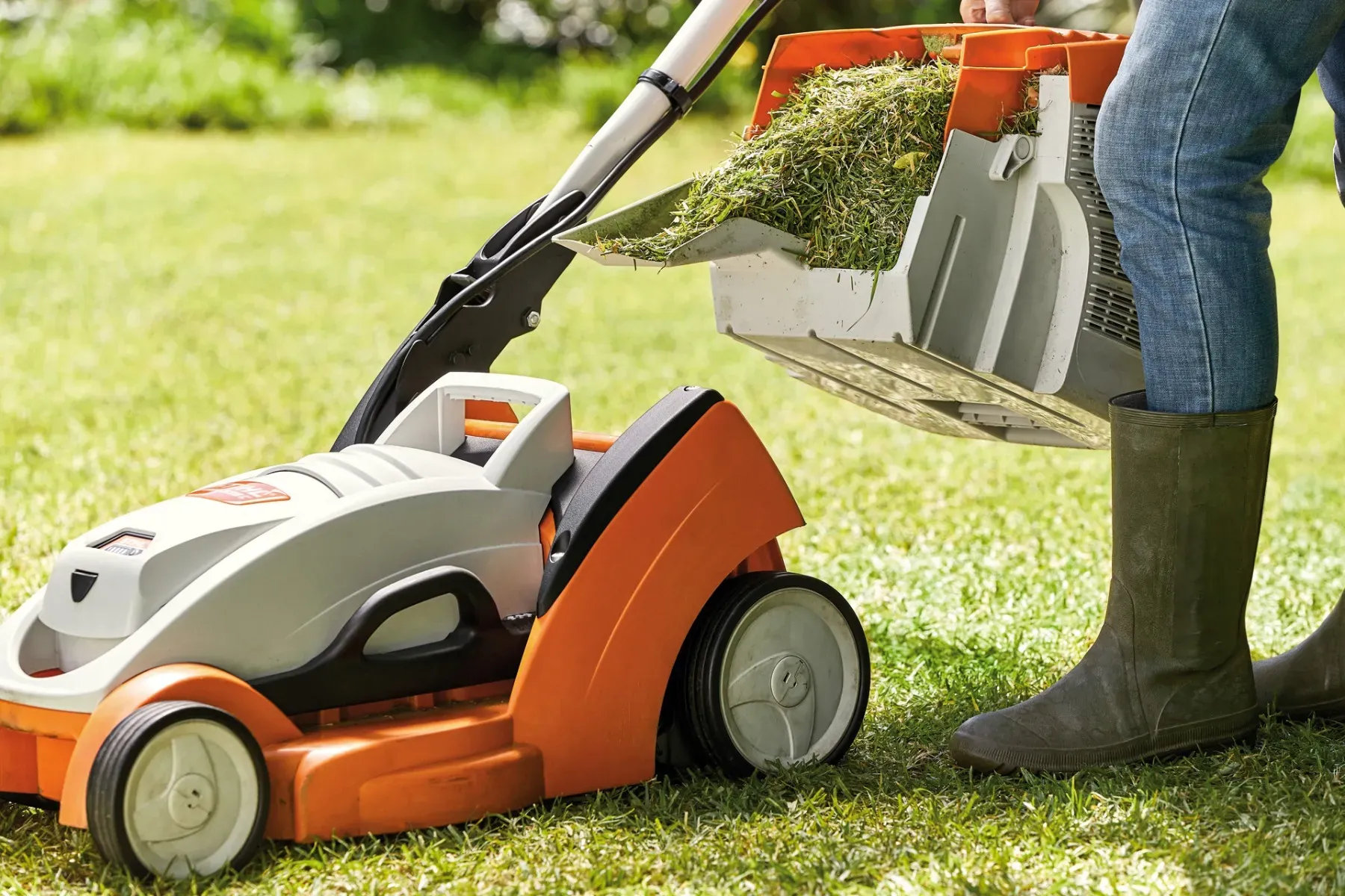 A STIHL lawn mower on a perfectly cut green lawn
